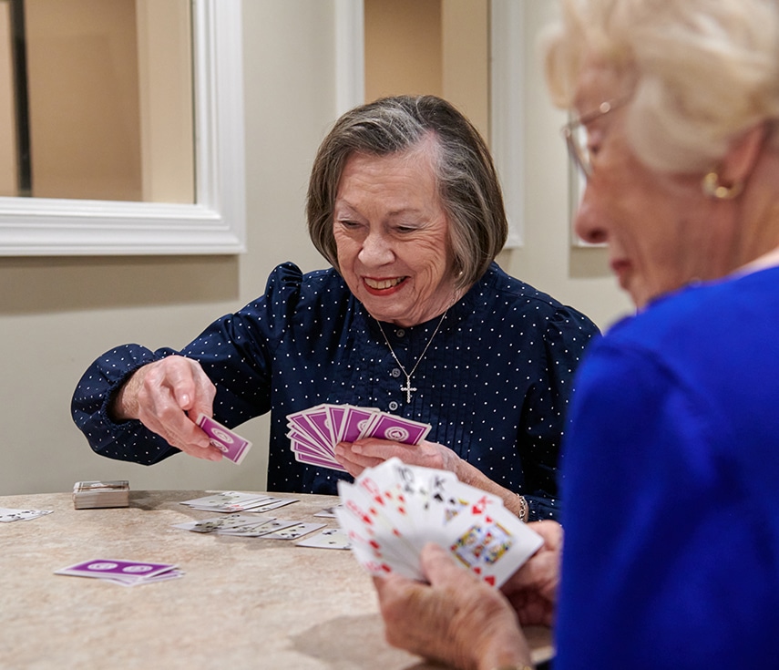 two women playing cards