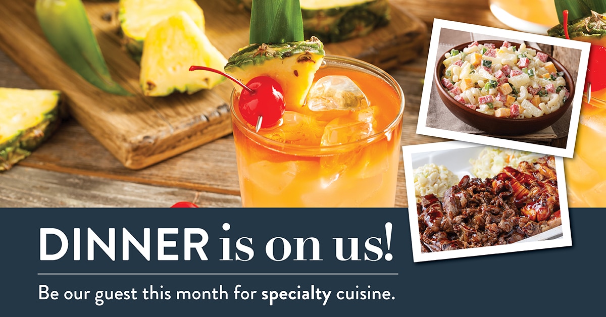 a pineapple drink with ice and a cherry, pasta salad and beef